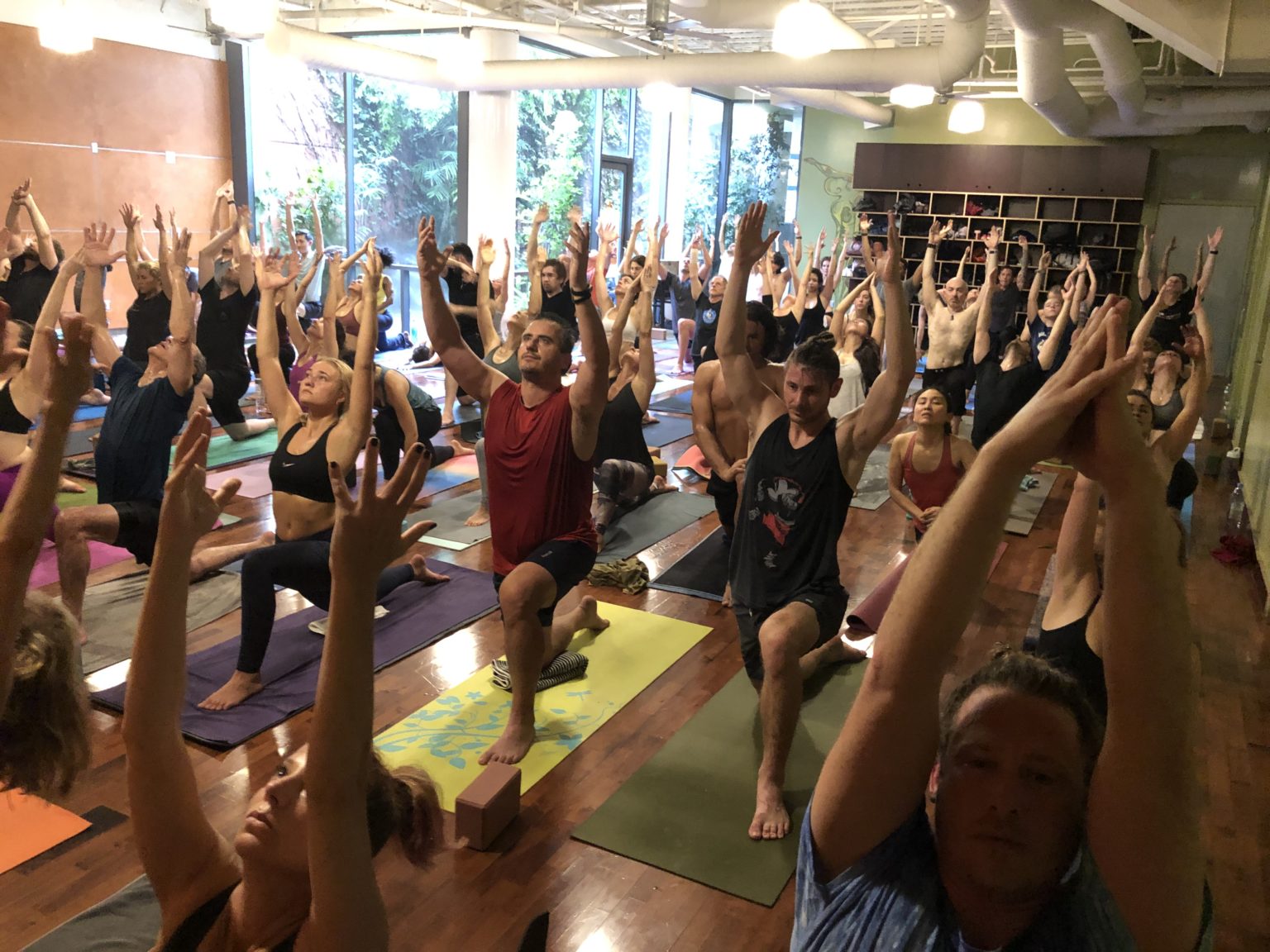 Yoga class doing lunge